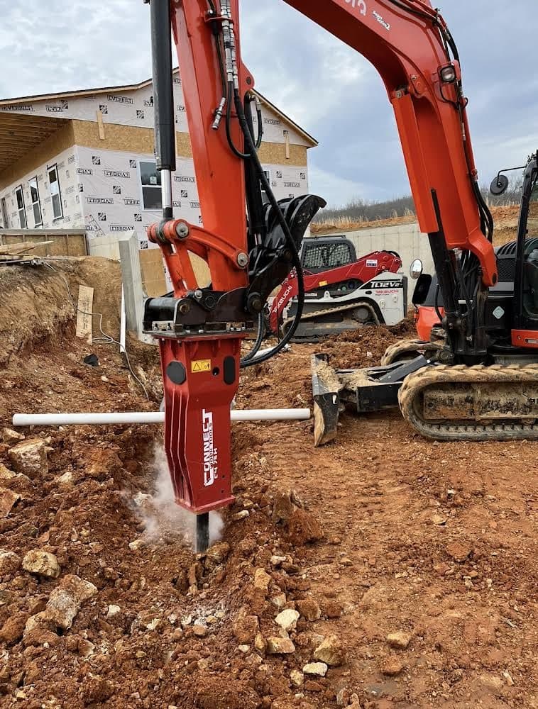 Excavator loading material on site