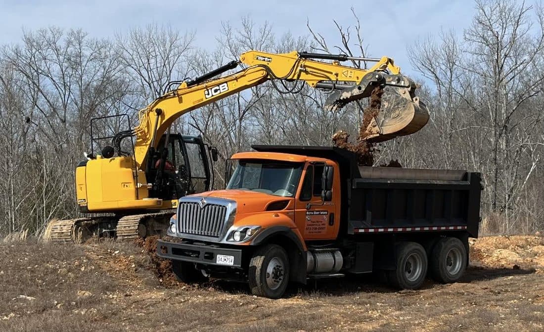 Roth Dirt Worx dump truck hauling material